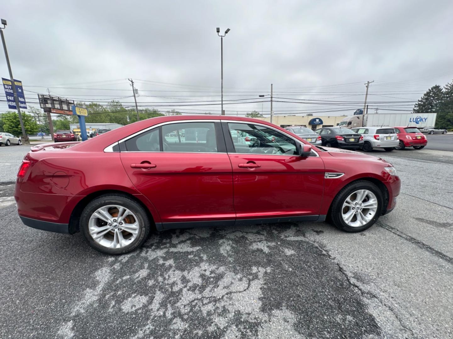 2013 RED Ford Taurus SEL FWD (1FAHP2E8XDG) with an 3.5L V6 DOHC 24V engine, 6-Speed Automatic transmission, located at 1254 Manheim Pike, Lancaster, PA, 17601, (717) 393-9133, 40.062870, -76.323273 - Photo#3